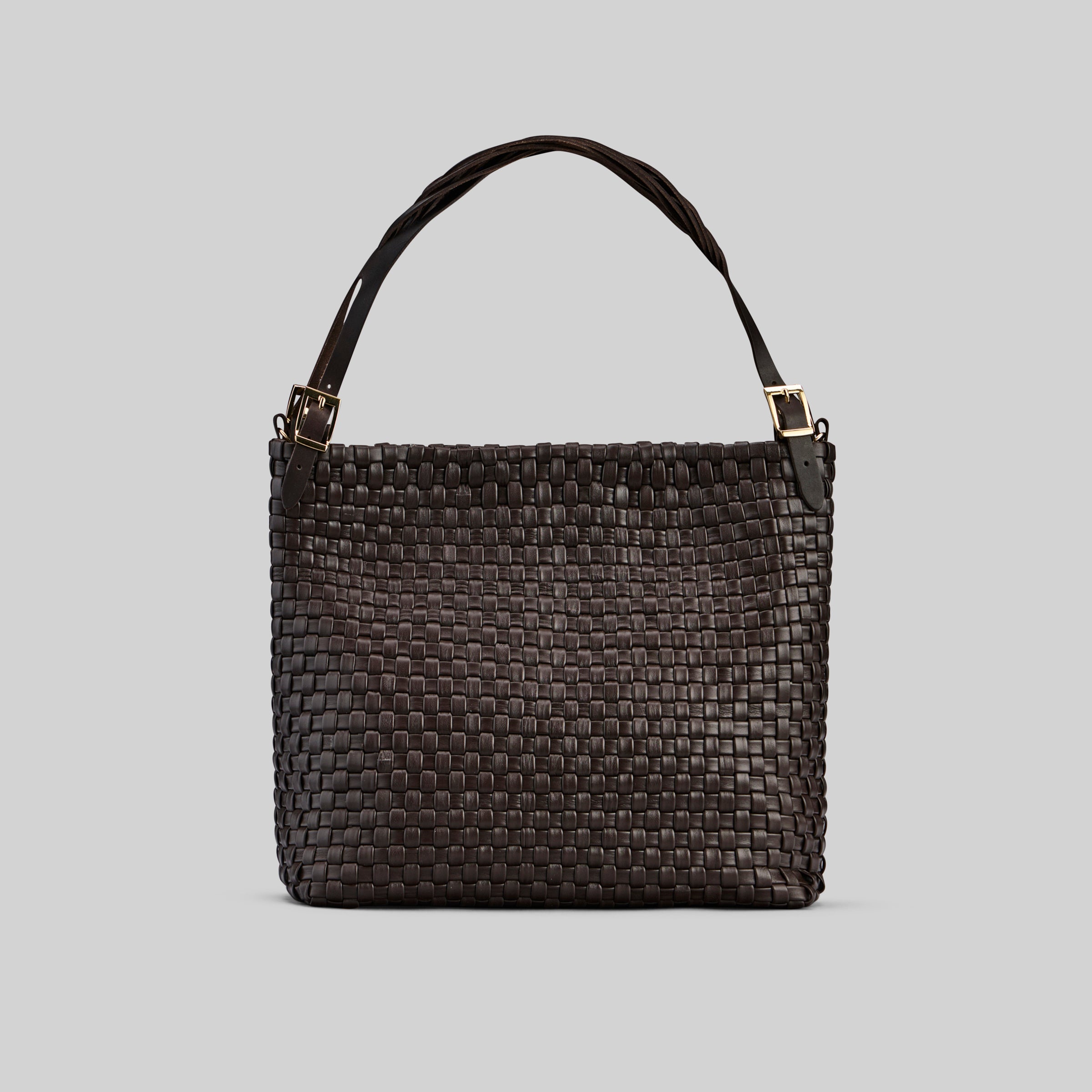 Ribichini Camper Clean veske i chocolate, glatt flettet lammeskinn, med matchende hank og elegante gylne detaljer