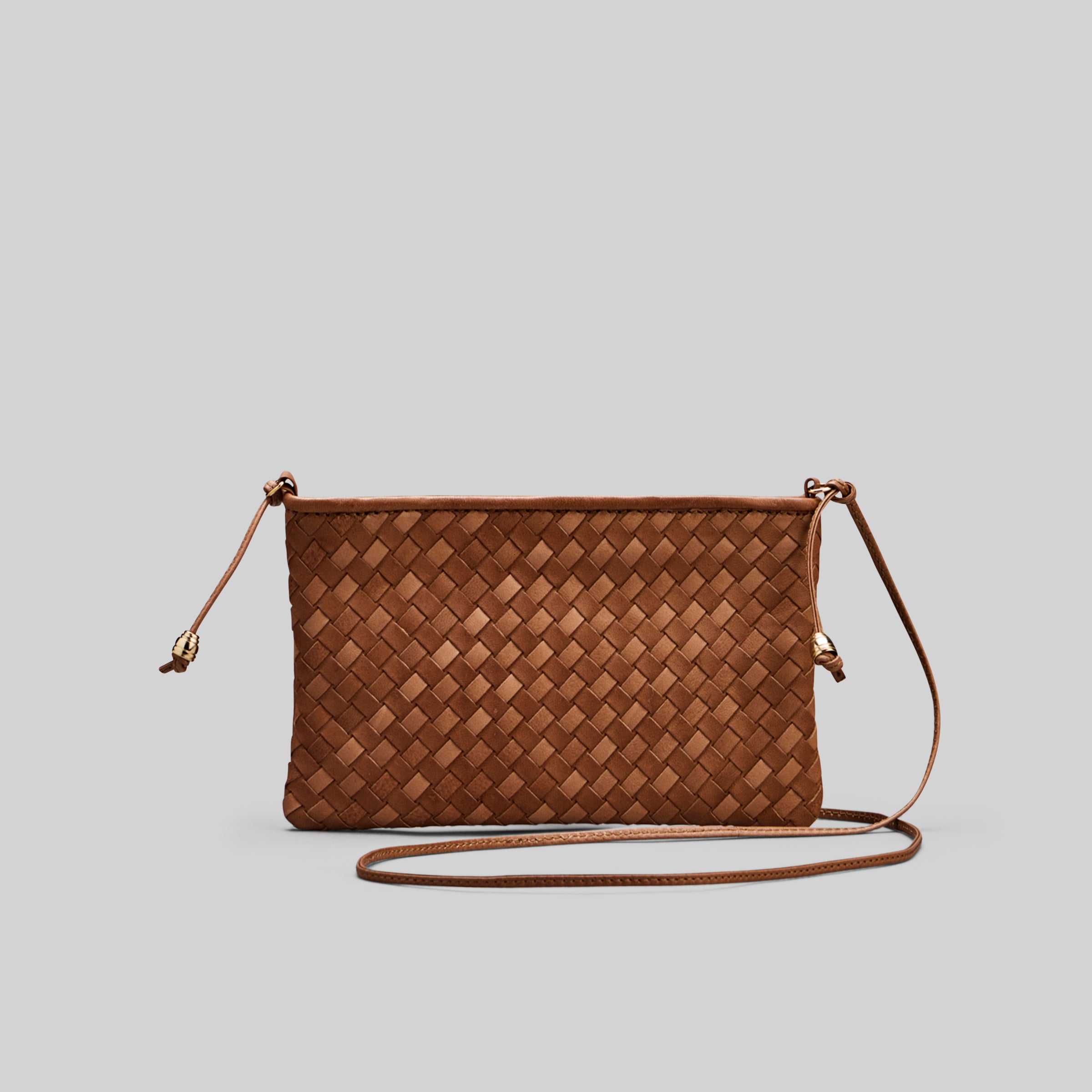 Ribichini Camper Clean Clutch i cognacfarget flettet lammeskinn.