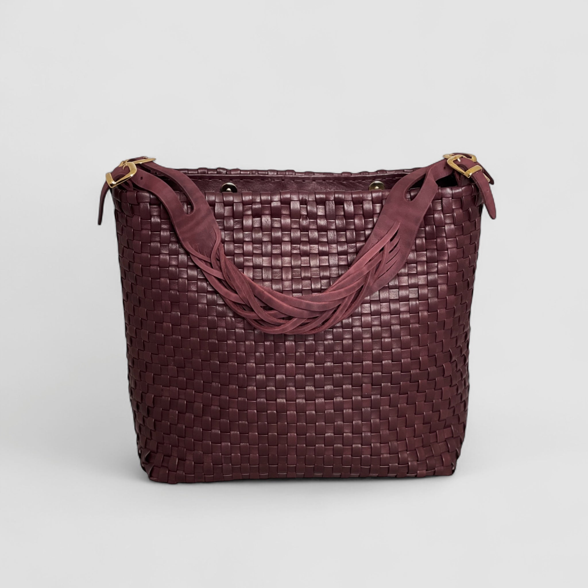 Ribichini Camper Clean veske i bordeaux glatt flettet lammeskinn med matchende hank og gylne detaljer.