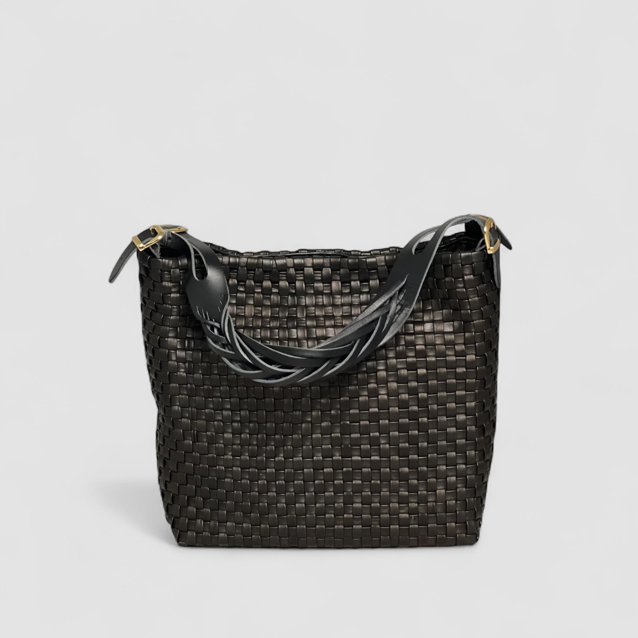 Ribichini Camper Clean i sort: glatt flettet lammeskinn, matchende hank. Elegante gulldetaljer for luksuspreg.