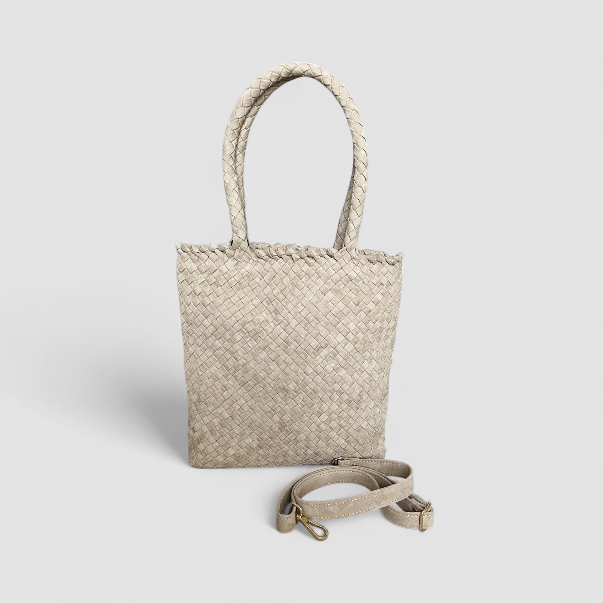 Sandfarget Ribichini Woodstock Royal Babe med avtagbar strop for fleksibel bærestil, praktisk og chic.