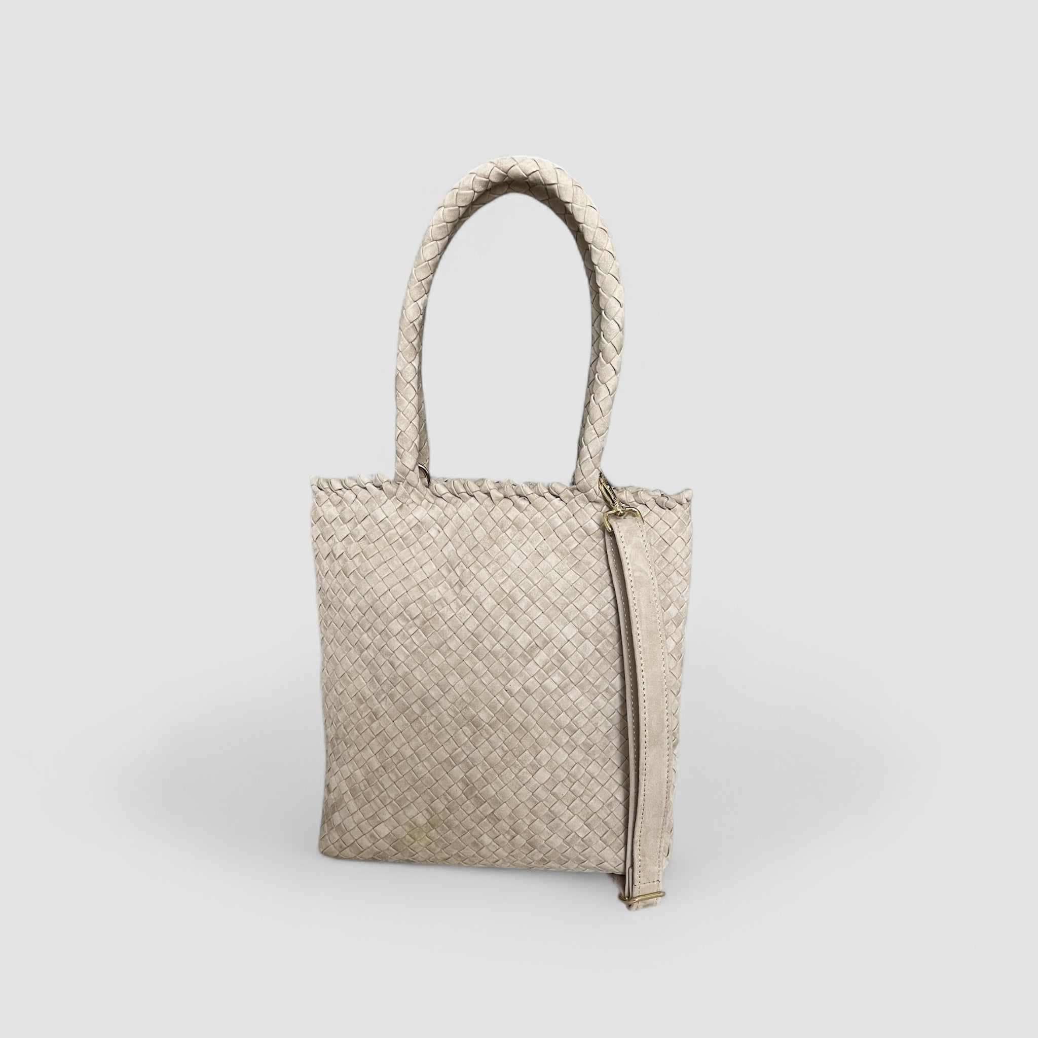 Ribichini Woodtock Royal Babe-vesken i sand med flettet semsket, avtagbar strop for allsidig stil.