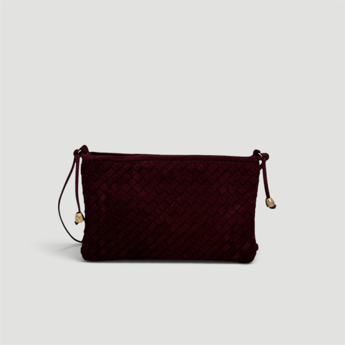 Ribichini Camper Clutch Suede Bordeaux – håndflettet clutch i burgunderrødt semsket lammeskinn med gulldetaljer.