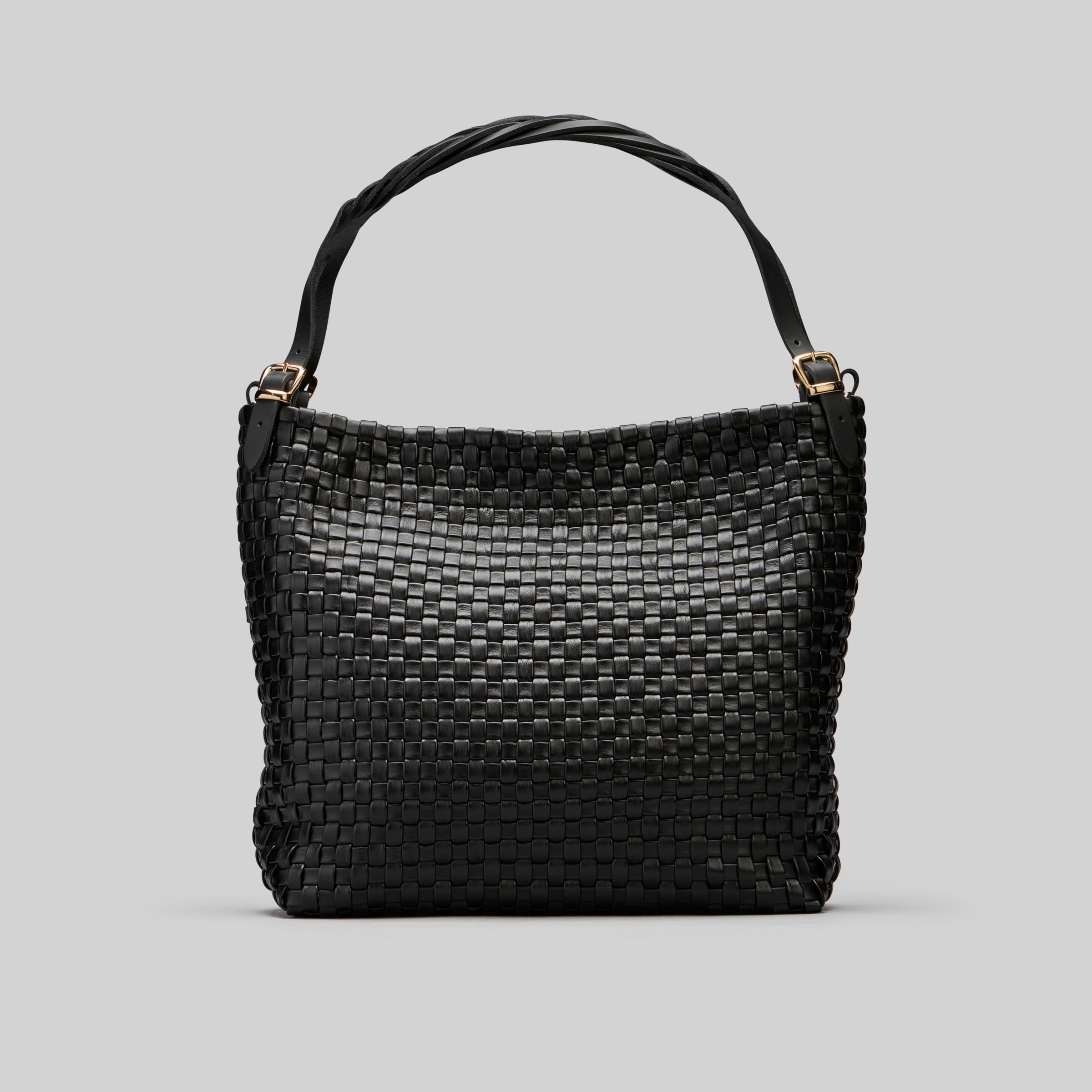 Ribichini Camper Clean i sort: glatt flettet lammeskinn, matchende hank. Elegante gulldetaljer for luksuspreg.